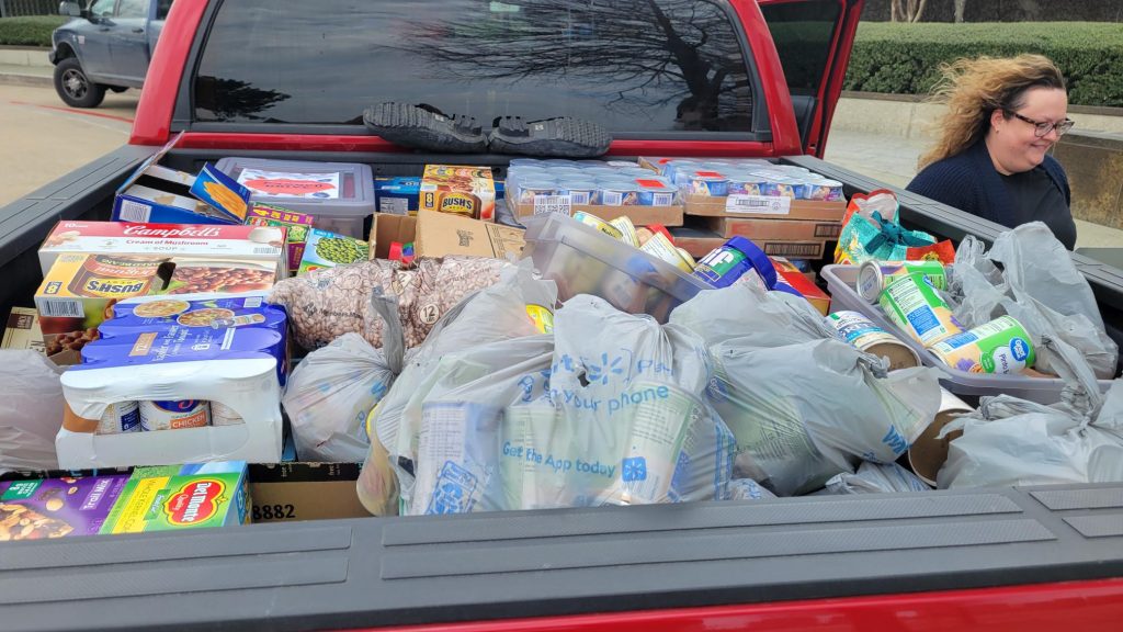 JPI canned food drive back of truck filled with food