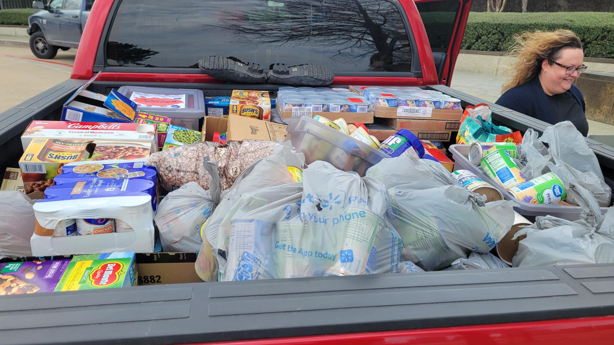 JPI canned food drive back of truck filled with food