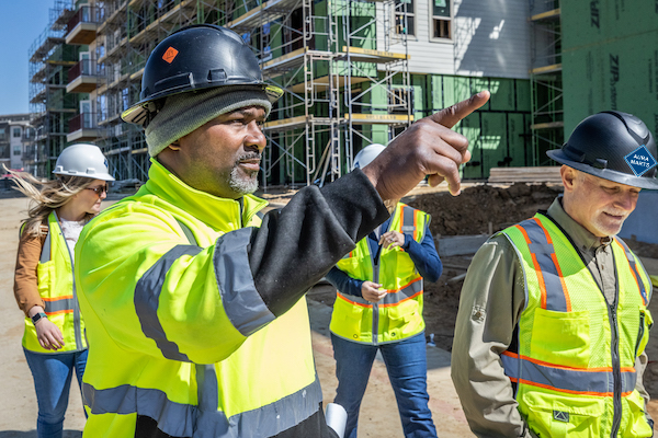 Aura Marts team reviewing construction site